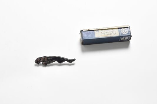 XJ III Centre Console Panel Badge, New Old Stock (BAC7015)